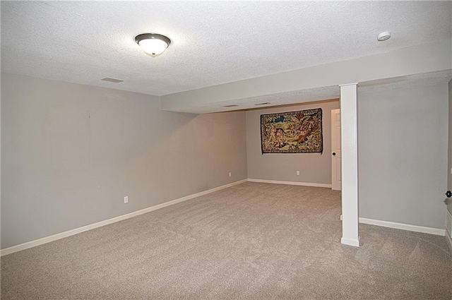 1748 NE Ridgeview Dr, Lees Summit, MO 64086 - finished basement featuring a textured ceiling, carpet, and baseboards