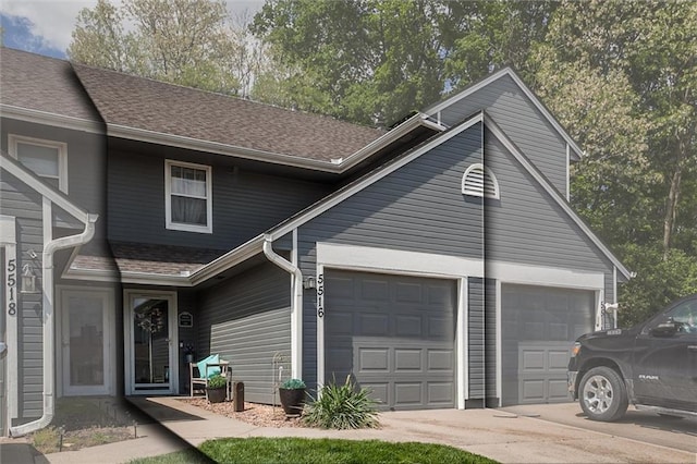 5516 66th Ter, Kansas City, MO 64151 - view of front of property with driveway, a garage, and roof with shingles