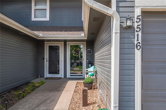 5516 66th Ter, Kansas City, MO 64151 - entrance to property featuring a shingled roof