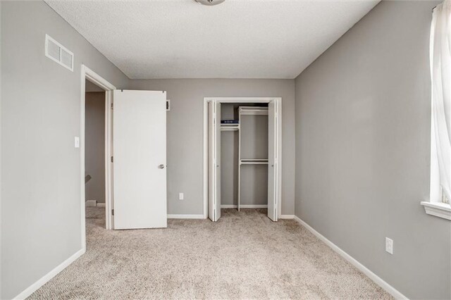 5516 66th Ter, Kansas City, MO 64151 - unfurnished bedroom with carpet floors, a closet, and baseboards
