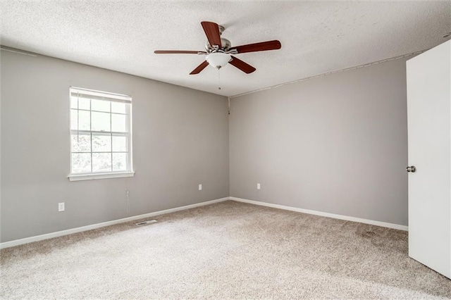 5516 66th Ter, Kansas City, MO 64151 - carpeted spare room featuring ceiling fan, a textured ceiling, and baseboards