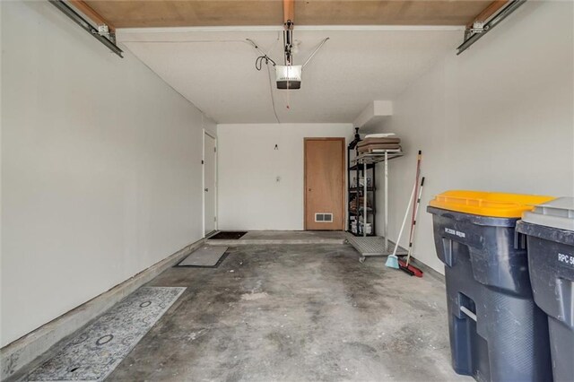 5516 66th Ter, Kansas City, MO 64151 - garage with a garage door opener