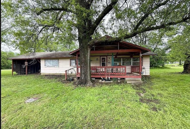 view of front of house with a front lawn and covered porch