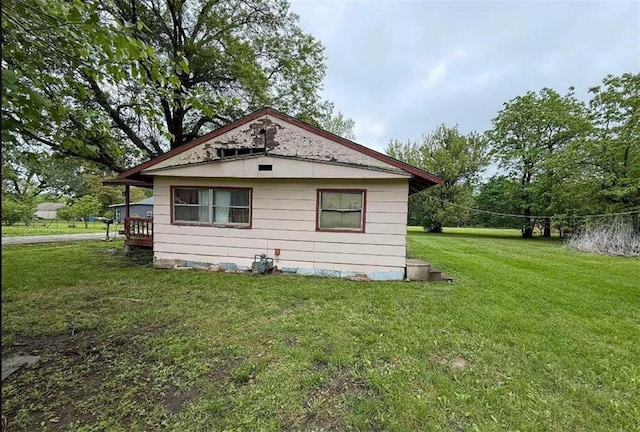 view of home's exterior featuring a lawn