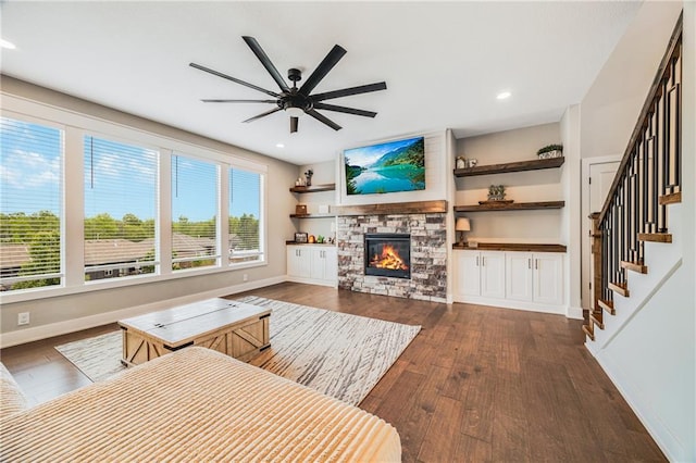 living room featuring ceiling fan, plenty of natural light, dark wood finished floors, and recessed lighting