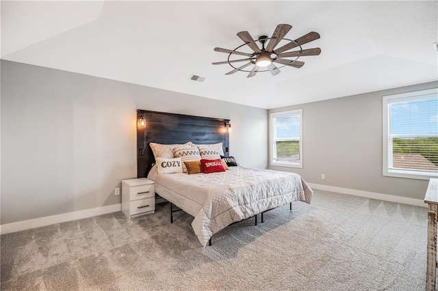 carpeted bedroom with baseboards and a ceiling fan