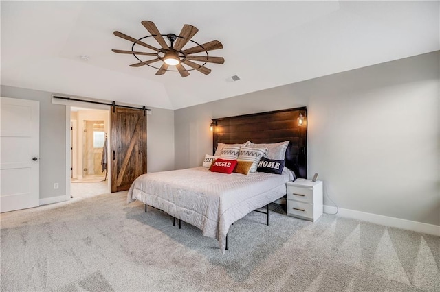 bedroom featuring vaulted ceiling, carpet floors, baseboards, a barn door, and a ceiling fan