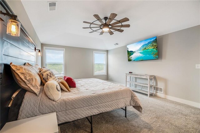 bedroom with carpet floors, baseboards, and a ceiling fan