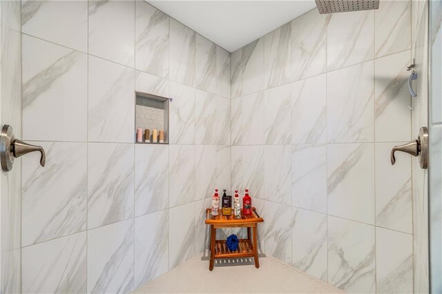 bathroom with tiled shower