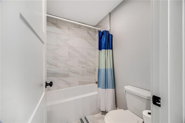 bathroom with toilet and shower / tub combo