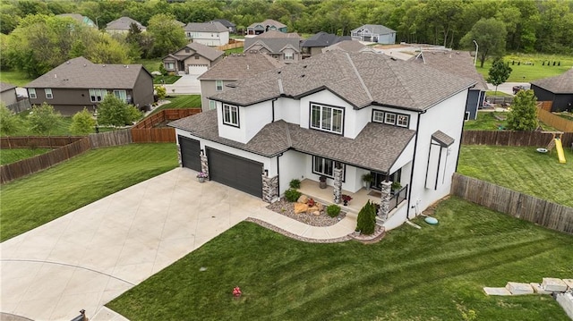 view of front of house with stucco siding, driveway, roof with shingles, and a residential view