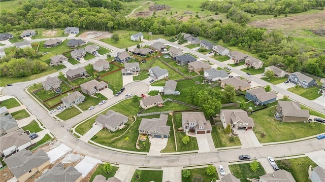 aerial view of property and surrounding area with nearby suburban area
