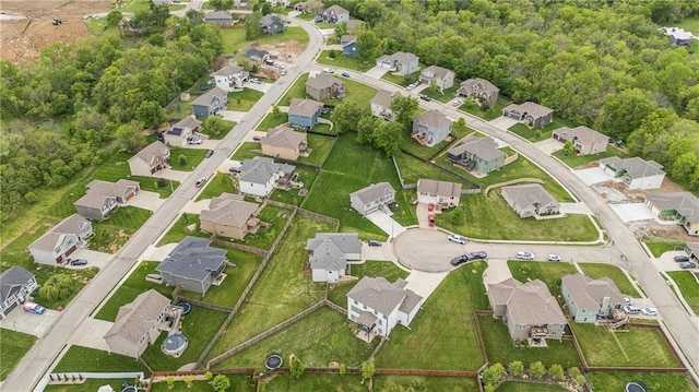 aerial view of property and surrounding area with nearby suburban area
