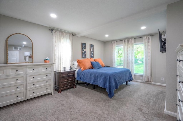 bedroom featuring recessed lighting, light colored carpet, and baseboards