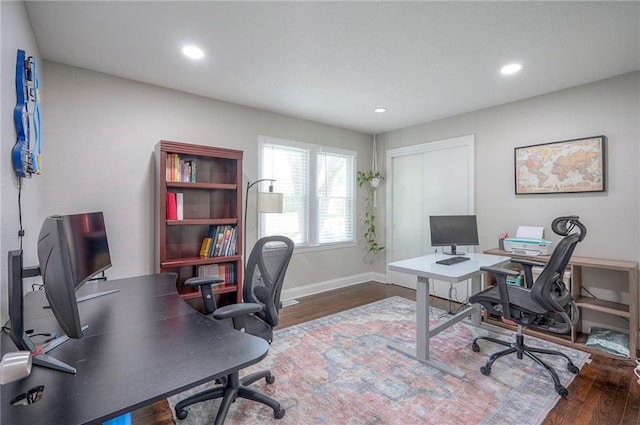 office featuring wood finished floors, baseboards, and recessed lighting