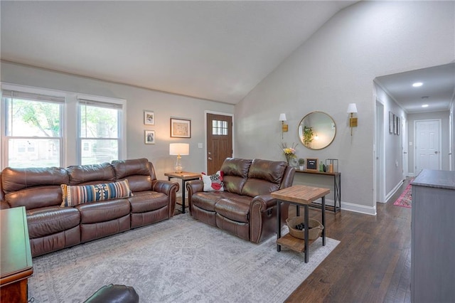 living room with dark wood finished floors, vaulted ceiling, and baseboards