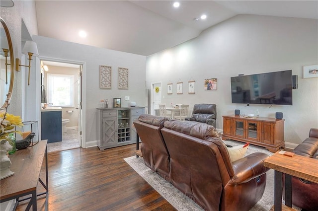 living area with lofted ceiling, dark wood finished floors, recessed lighting, and baseboards