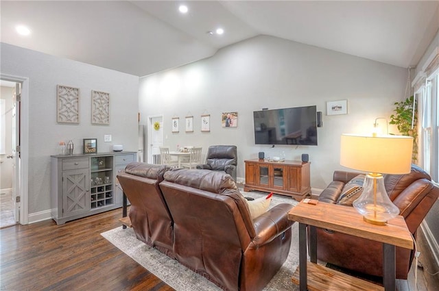 living room featuring dark wood-type flooring, vaulted ceiling, recessed lighting, and baseboards