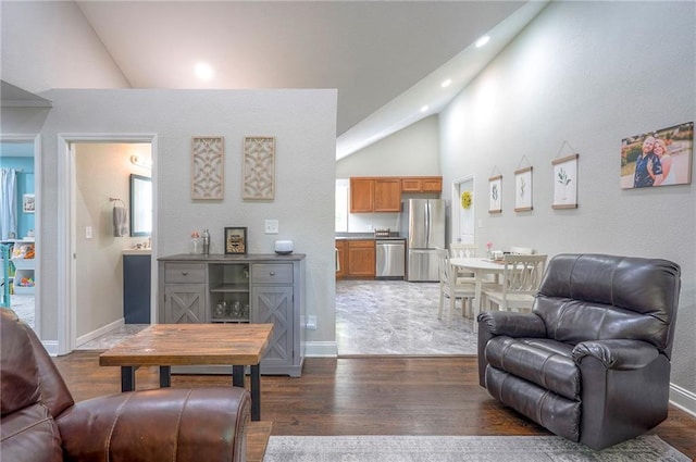 living room with dark wood-style flooring, recessed lighting, high vaulted ceiling, and baseboards