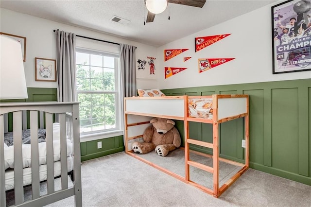 1849 W Cedar St, Olathe, KS 66061 - carpeted bedroom with wainscoting and a decorative wall