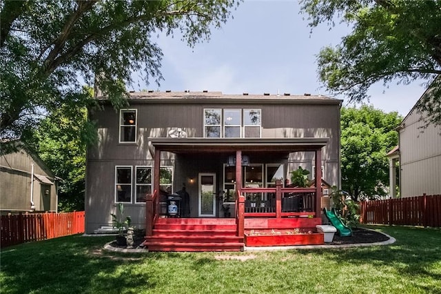 1849 W Cedar St, Olathe, KS 66061 - rear view of property with a fenced backyard and a playground