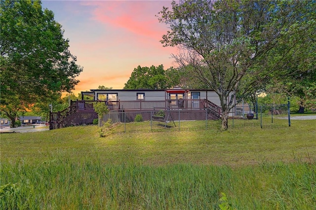 33 Lakeview Ln, Linn Valley, KS 66040 - view of front of house with a wooden deck, stairs, and a yard