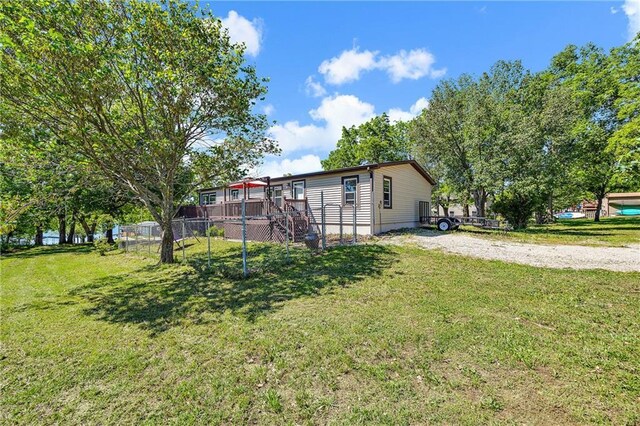 33 Lakeview Ln, Linn Valley, KS 66040 - rear view of house with a deck and stairs