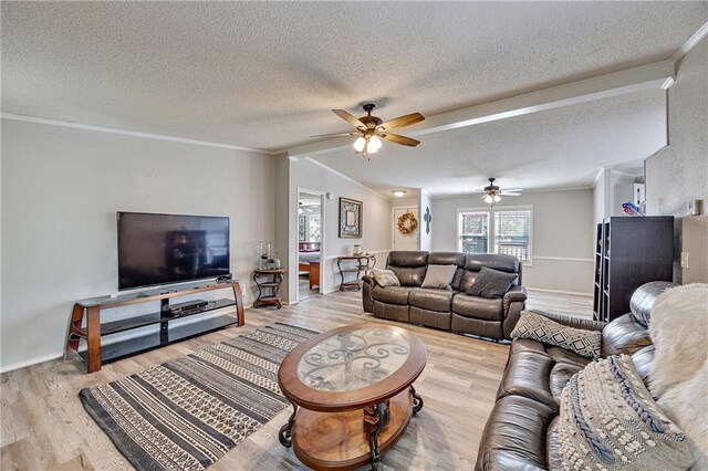 33 Lakeview Ln, Linn Valley, KS 66040 - living area with ornamental molding, wood finished floors, ceiling fan, a textured ceiling, and lofted ceiling
