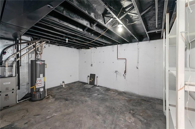 unfinished below grade area with water heater and heating unit