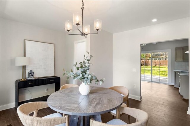 506 W 86th St, Kansas City, MO 64114 - dining space with a chandelier, dark wood-type flooring, baseboards, and recessed lighting
