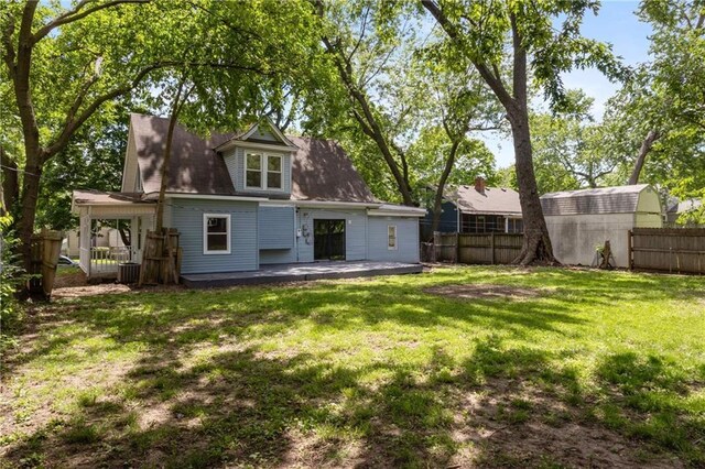 506 W 86th St, Kansas City, MO 64114 - rear view of house featuring a patio area