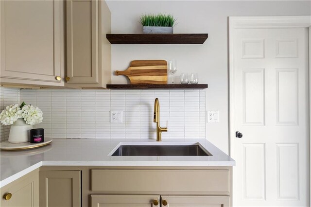 506 W 86th St, Kansas City, MO 64114 - kitchen featuring open shelves, a sink, decorative backsplash, and light countertops