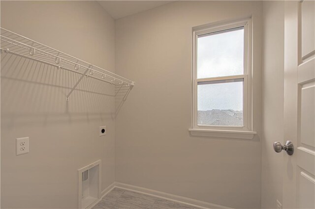 6106 NE 118th St, Kansas City, MO 64156 - laundry room featuring electric dryer hookup and baseboards