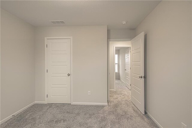 6106 NE 118th St, Kansas City, MO 64156 - unfurnished bedroom featuring light colored carpet and baseboards
