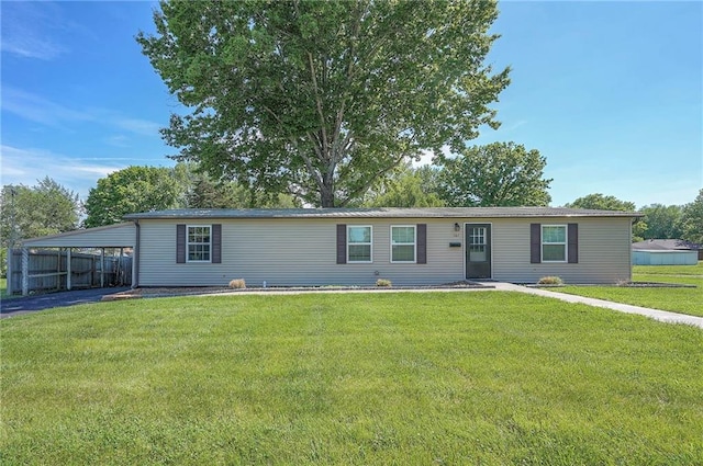 507 W 26th St, Higginsville, MO 64037 - manufactured / mobile home with an attached carport and driveway