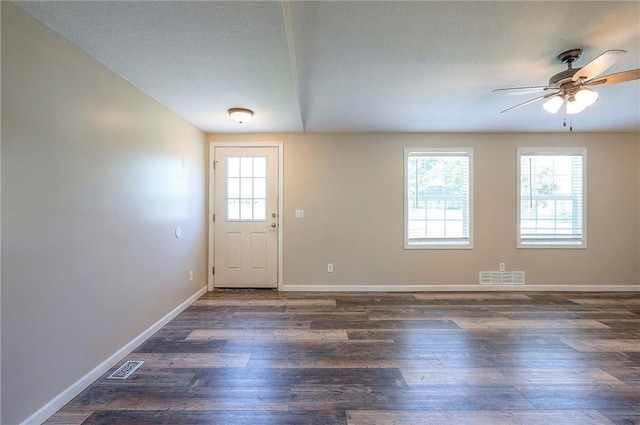 507 W 26th St, Higginsville, MO 64037 - foyer featuring a ceiling fan, wood finished floors, and baseboards