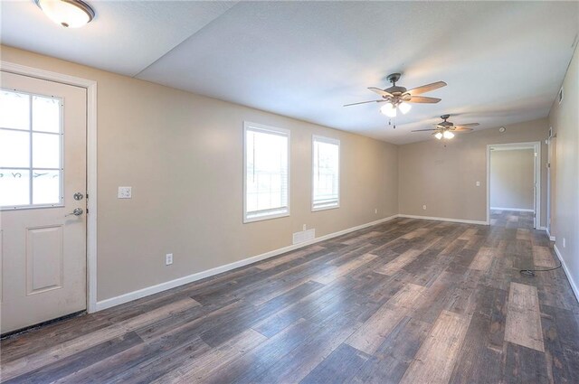507 W 26th St, Higginsville, MO 64037 - unfurnished room featuring plenty of natural light, a ceiling fan, and wood finished floors