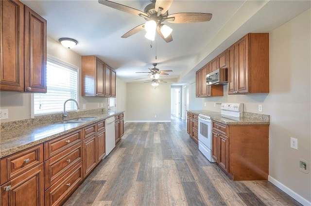 507 W 26th St, Higginsville, MO 64037 - kitchen featuring white appliances, a sink, brown cabinetry, and dark wood finished floors