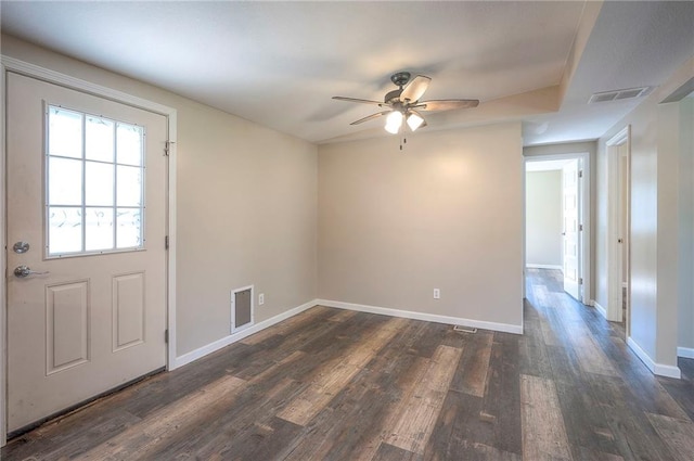507 W 26th St, Higginsville, MO 64037 - unfurnished room with ceiling fan, dark wood-type flooring, and baseboards