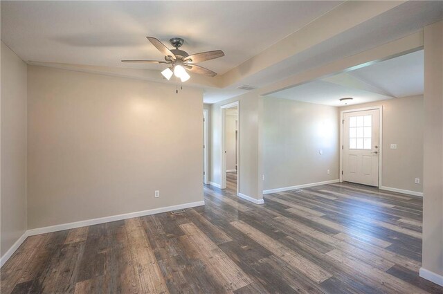 507 W 26th St, Higginsville, MO 64037 - unfurnished room with dark wood-type flooring, baseboards, and ceiling fan