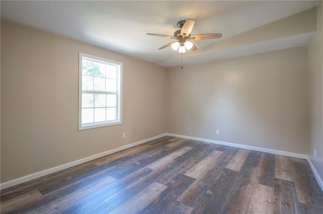 507 W 26th St, Higginsville, MO 64037 - empty room featuring ceiling fan, baseboards, and dark wood-style floors