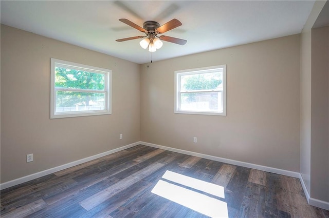 507 W 26th St, Higginsville, MO 64037 - spare room featuring baseboards, ceiling fan, and wood finished floors