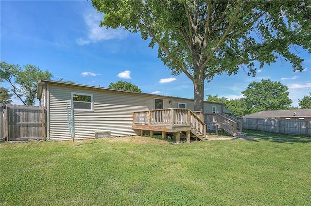 507 W 26th St, Higginsville, MO 64037 - back of property featuring a wooden deck and stairway