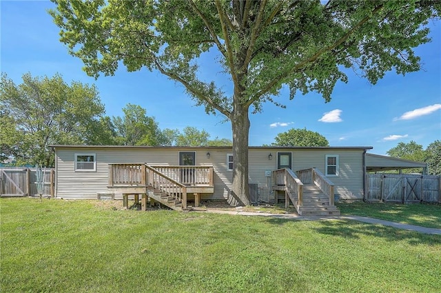 507 W 26th St, Higginsville, MO 64037 - rear view of house featuring a deck, a gate, and stairs