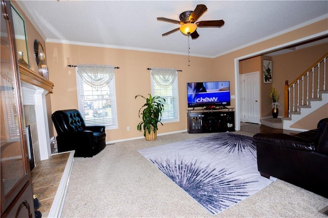 16366 S Hunter St, Olathe, KS 66062 - living room featuring a fireplace with raised hearth, carpet floors, stairs, ornamental molding, and ceiling fan