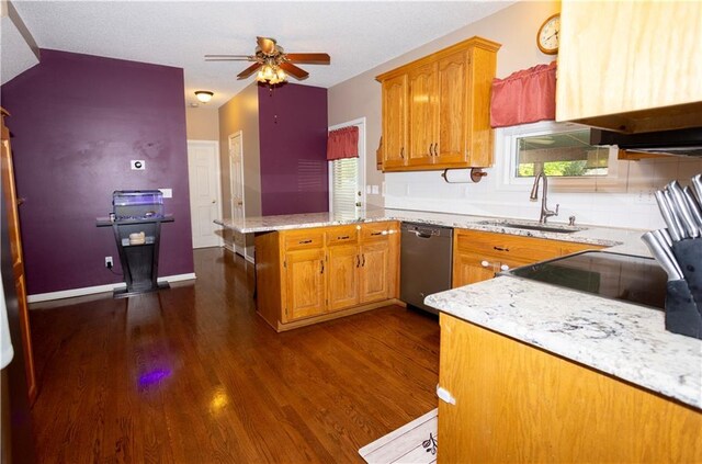 16366 S Hunter St, Olathe, KS 66062 - kitchen with dishwasher, a sink, a peninsula, dark wood-type flooring, and plenty of natural light