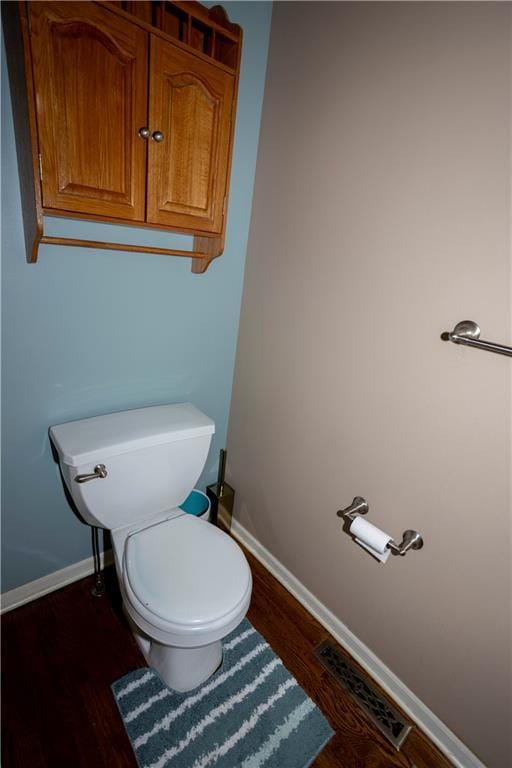16366 S Hunter St, Olathe, KS 66062 - bathroom featuring wood finished floors, baseboards, and toilet