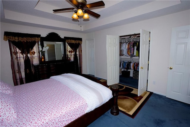 16366 S Hunter St, Olathe, KS 66062 - carpeted bedroom featuring a raised ceiling, a closet, baseboards, and ceiling fan