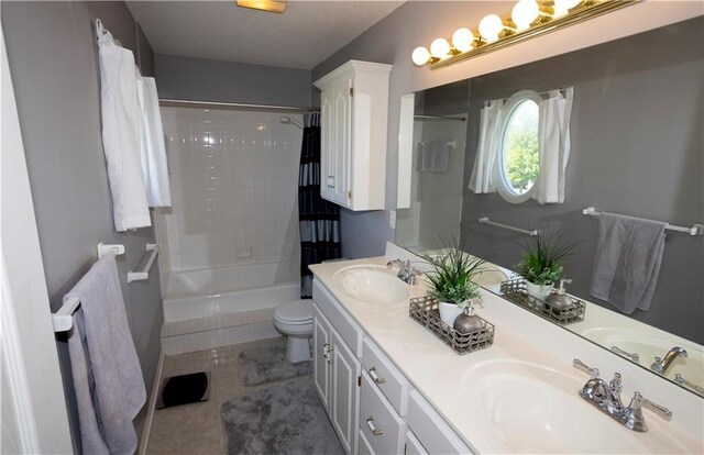 16366 S Hunter St, Olathe, KS 66062 - bathroom featuring toilet, double vanity, shower / tub combination, and tile patterned floors
