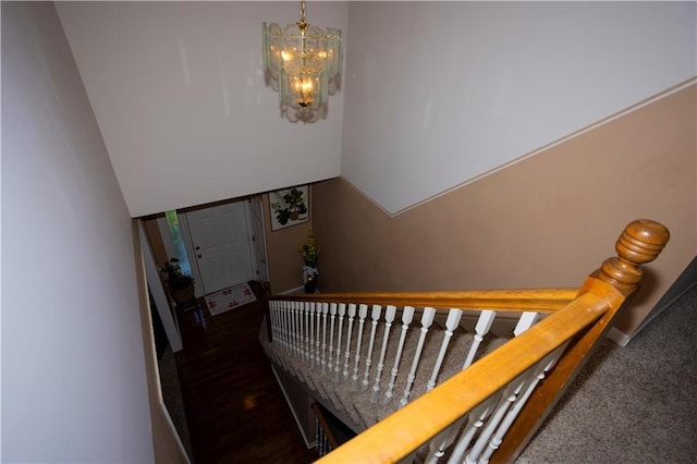 16366 S Hunter St, Olathe, KS 66062 - stairs featuring a chandelier and baseboards